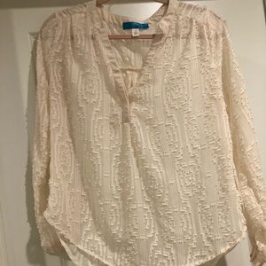 Cream blouse with fun detailing!